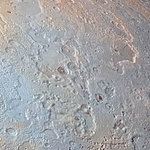 Поверхность планеты Плутон в серебристом цвете