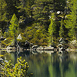 Lake between mountainous, green landscape