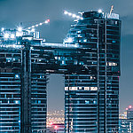 Skyscraper at night in dark blue